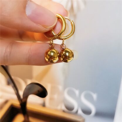 gold hoops, ball earrings