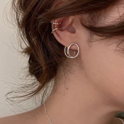silver earrings swirl