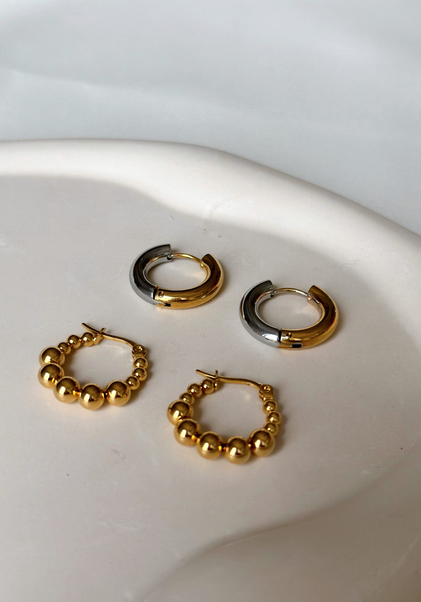 gold earrings, gold hoops, jewelry store, jewelry shop, trending jewelry